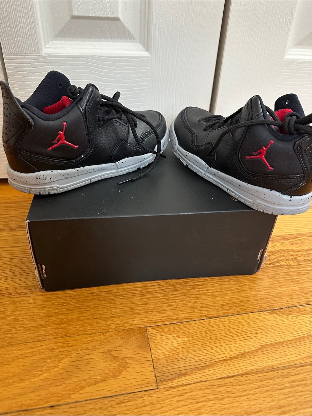 Jordan Kids Black Sneakers with Red Jumpman and Gray Sole